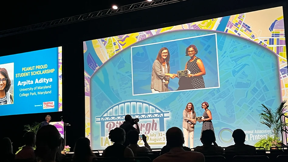 Arita Aditya receiving Peanut Proud Student Scholarship Award at IAFP 2022